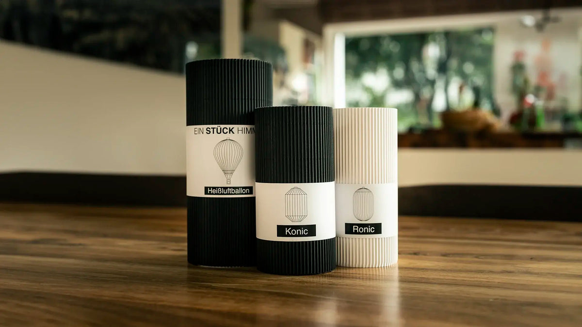 Drei Verpackungen von Benago Lights für die Lampenschirme Heißluftballon, Konic und Ronic
